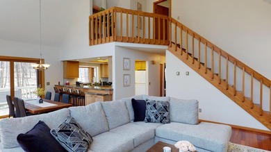 Step into this warm and inviting 3-bedroom, 2-bath chalet - photo 4