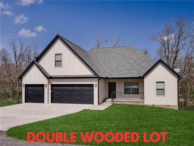 Discover this stunning home set on a spacious .50-acre wooded - photo 1