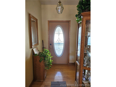 This lakefront homes has many pluses: one level living, attached - photo 15