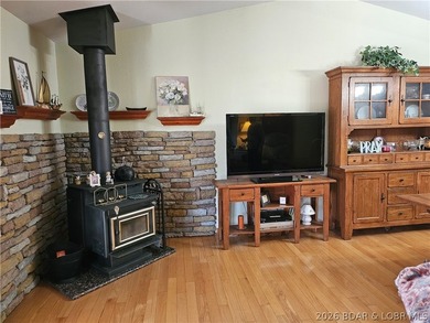 This lakefront homes has many pluses: one level living, attached - photo 18