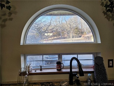 This lakefront homes has many pluses: one level living, attached - photo 21