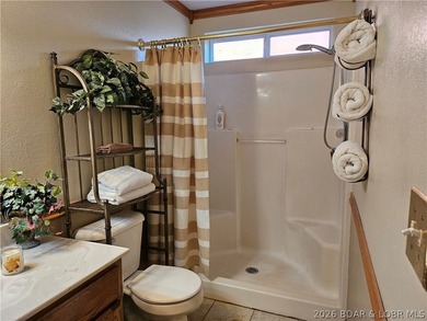 This lakefront homes has many pluses: one level living, attached - photo 33