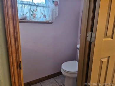 This lakefront homes has many pluses: one level living, attached - photo 49