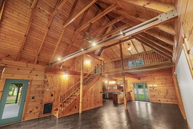 Step inside and the drama begins immediately. Soaring ceilings - photo 11