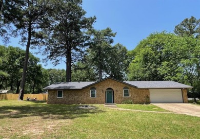 Welcome to this beautifully updated 4 bedroom, 2 bath brick home - Lake Home For Sale in Lone Star, Texas
