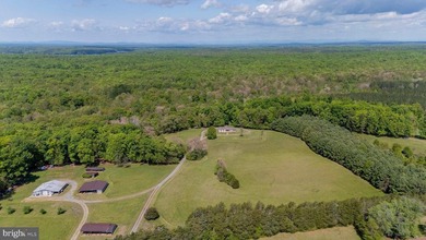 Set on 30 picturesque acres, this exceptional farm offers the - photo 2