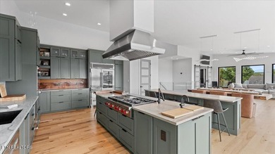 Welcome to 428 River Bend Drive, a stunning home perched on a - photo 13