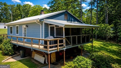 This cute cabin on year-round deep water is the lakefront - photo 1