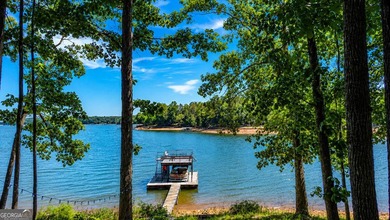 This cute cabin on year-round deep water is the lakefront - photo 9
