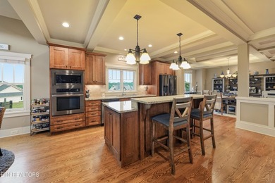 Perched on a hill within the prestigious gated community of - photo 6