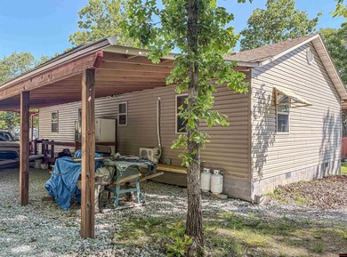 Tucked away in the beautiful Ozarks near Bull Shoals Lake, this - photo 11