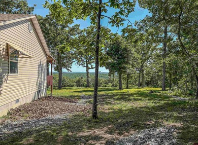 Tucked away in the beautiful Ozarks near Bull Shoals Lake, this - photo 13
