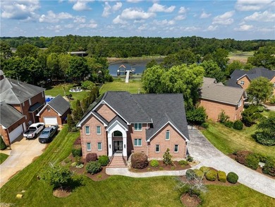 A beautiful brick waterfront home located in Mariners Pointe! - photo 1