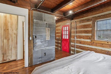 Tucked away on a serene 2-acre wooded lot in the highly - photo 17