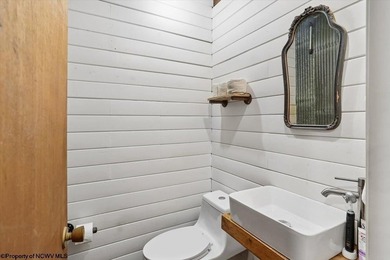 Tucked away on a serene 2-acre wooded lot in the highly - photo 19