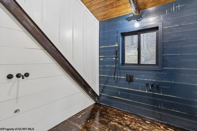 Tucked away on a serene 2-acre wooded lot in the highly - photo 25