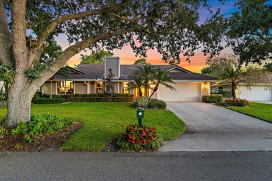 Nestled on an oversized, beautifully landscaped lot in the - photo 1