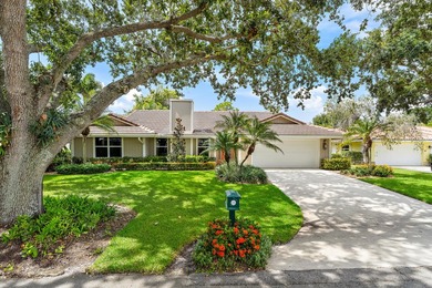 Nestled on an oversized, beautifully landscaped lot in the - photo 2