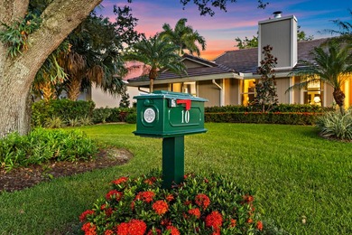 Nestled on an oversized, beautifully landscaped lot in the - photo 3