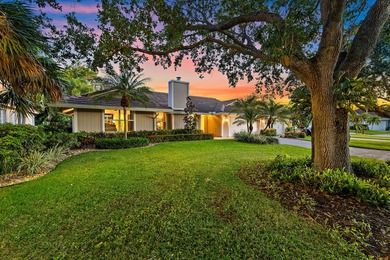 Nestled on an oversized, beautifully landscaped lot in the - photo 4