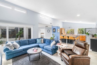 Beautiful golf course views surround this bright and inviting