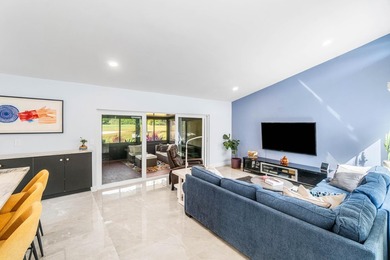 Beautiful golf course views surround this bright and inviting