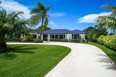 Nestled in the heart of Palm Beach Gardens, this masterfully - photo 1