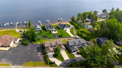 Enjoy elevated panoramic views of Houghton Lake from this - photo 3