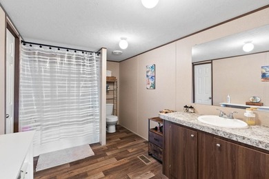 Canal-front turnkey coastal retreat with private fishing dock - photo 20