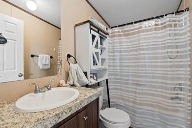 Canal-front turnkey coastal retreat with private fishing dock - photo 23