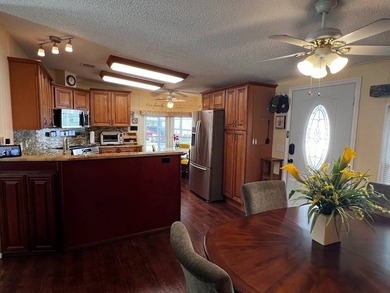 This well-maintained home features a membrane roof over the home - photo 9