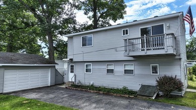 Wake up to beautiful views of Houghton Lake from the spacious - photo 1