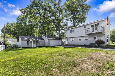 Wake up to beautiful views of Houghton Lake from the spacious - photo 2
