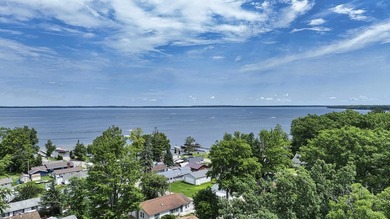 Wake up to beautiful views of Houghton Lake from the spacious - photo 6