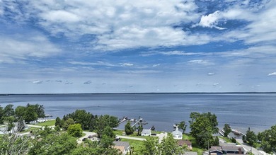 Wake up to beautiful views of Houghton Lake from the spacious - photo 8