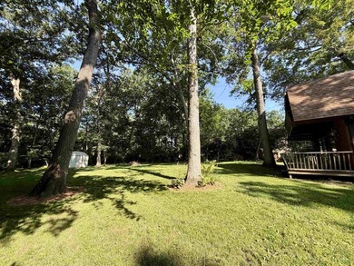 Nestled on a beautifully wooded lot in the gated community of - photo 31