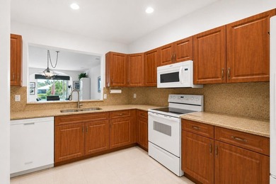 Enjoy peaceful lake views from this well-maintained villa in the - photo 3