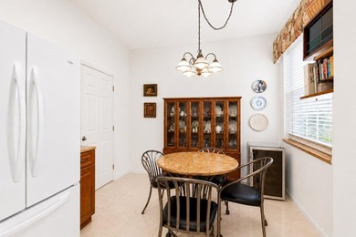 Enjoy peaceful lake views from this well-maintained villa in the - photo 7