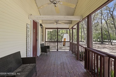 Adorable home with rustic farmhouse flair nestled on just over - photo 5