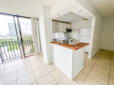 Great 2/2 , plus a Den, half a block from the beach on the - photo 3