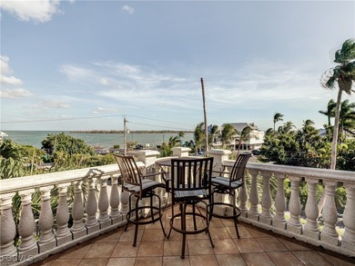 Experience the timeless coastal allure of 15160 Captiva Drive, a - photo 18
