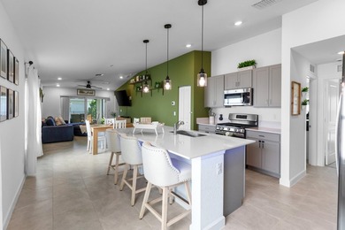 This new single-story home features a smart layout designed for - photo 4