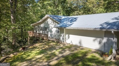 What a rare gem! Imagine 4 wooded and private acres, 750ft - photo 7