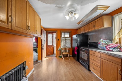 Three bedroom cape on level lot. Large living room, kitchen and