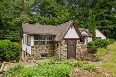 Storybook charm! This inviting two-bedroom cottage sits - photo 2