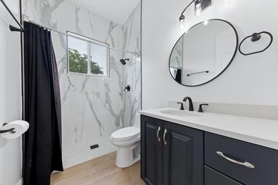 Over $300,000 in renovations. Custom single-story estate in an - photo 39