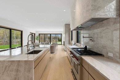 A newly built modern showpiece with sweeping bay and pond views - photo 8