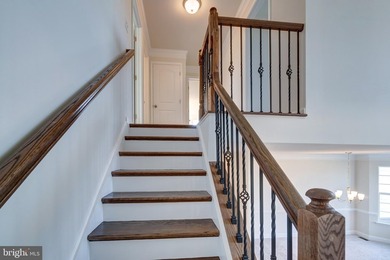 The Legend features a 1st-floor owner suite with a grand - photo 10