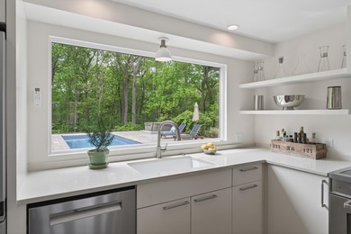 Perched on an elevated 1+ acre lot in the coveted Shore Acres - photo 27