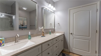 Experience the ultimate lake lifestyle in this impeccably